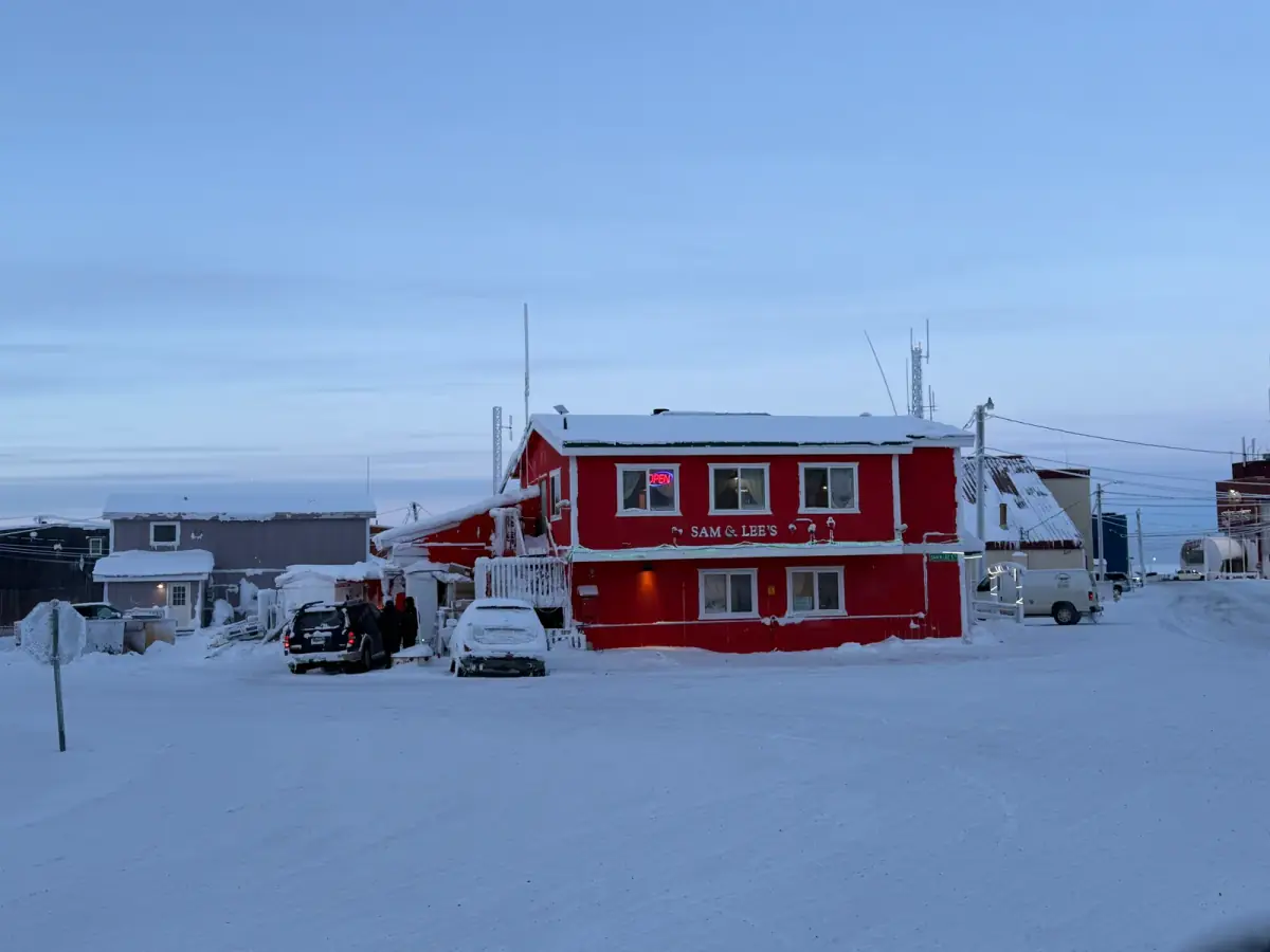 Sam & Lee's Restaurant exterior on a winter evening — Kogiak Street, Utqiagvik