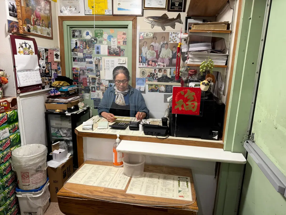 Mrs. Kim at the Sam and Lee's front counter